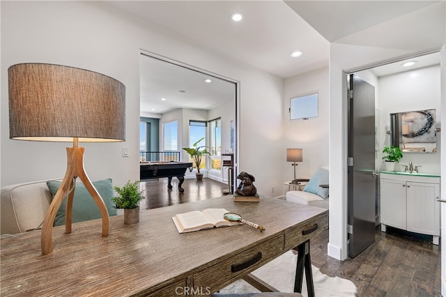 office area with dark hardwood / wood-style floors, sink, and billiards