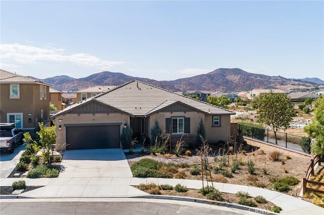 view of front of house with a mountain view and a garage