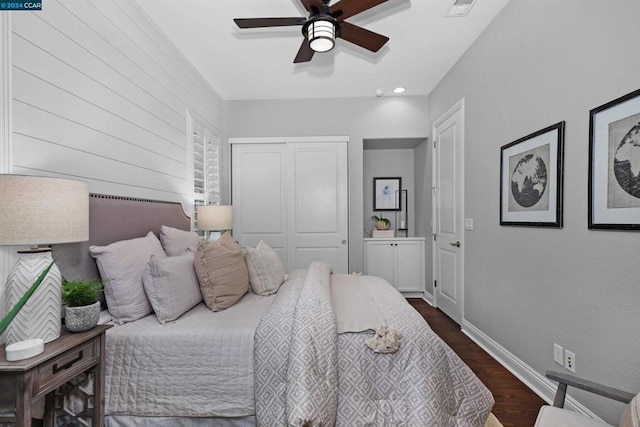 bedroom featuring a closet, ceiling fan, and dark hardwood / wood-style floors