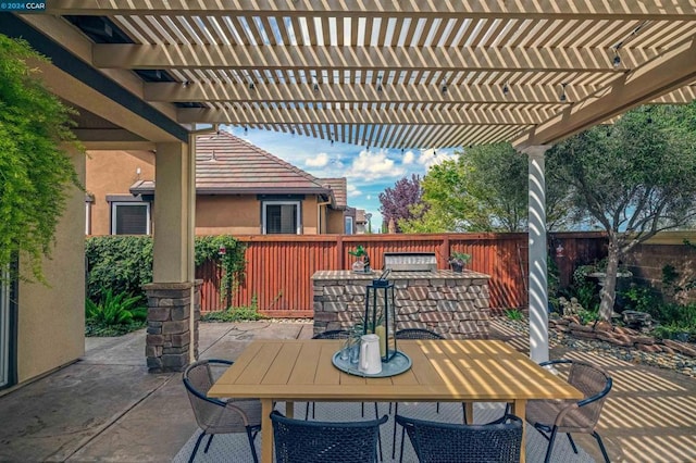 view of patio / terrace with a pergola and exterior bar