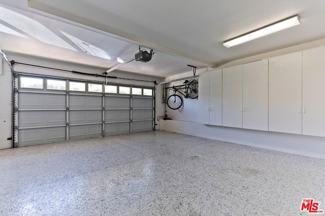 garage featuring a garage door opener