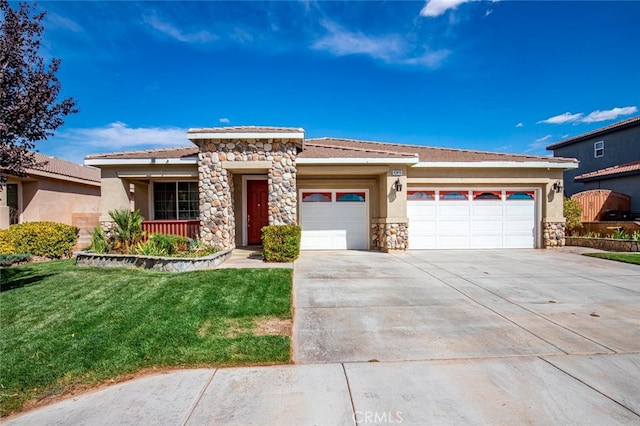 prairie-style house with a garage and a front lawn