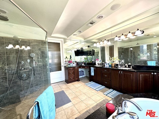 bathroom featuring vanity, shower with separate bathtub, and tile patterned flooring