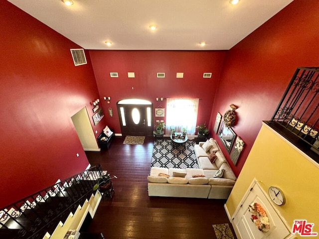 unfurnished living room with dark hardwood / wood-style floors