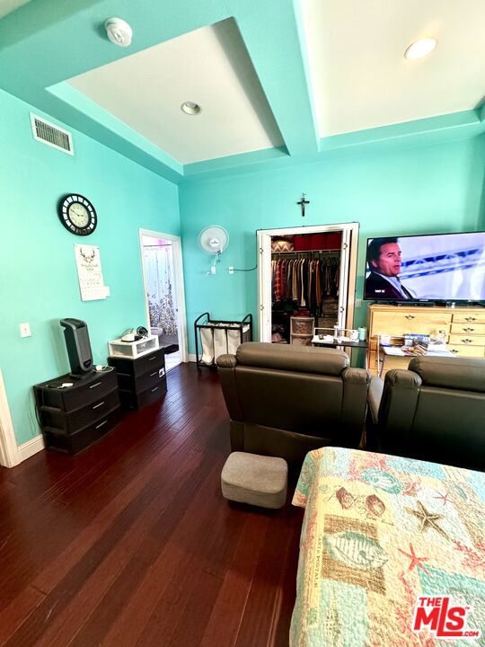 living room with dark hardwood / wood-style flooring