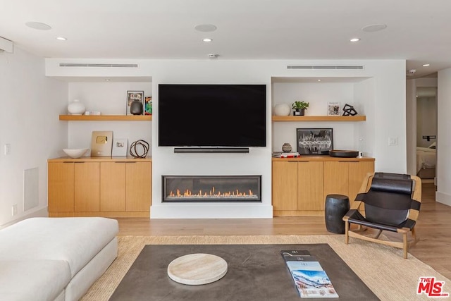 living room with light hardwood / wood-style floors