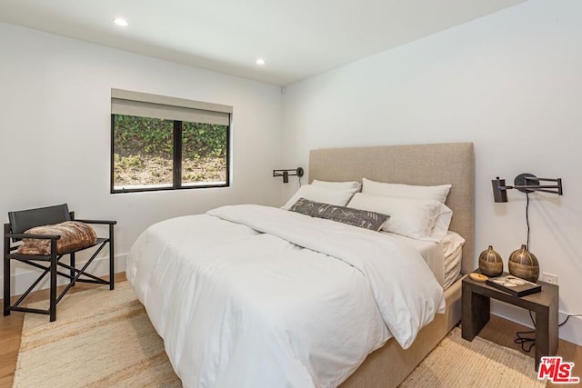 bedroom featuring light hardwood / wood-style floors