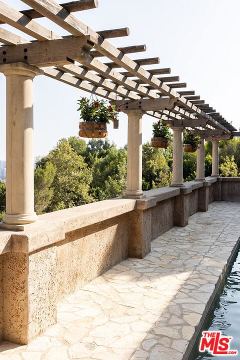 view of patio featuring a pergola