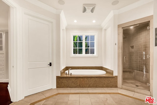 bathroom featuring ornamental molding, separate shower and tub, and tile patterned floors