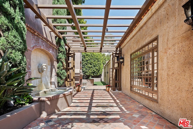 view of patio featuring a pergola