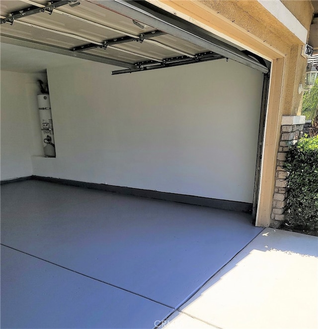 garage featuring secured water heater