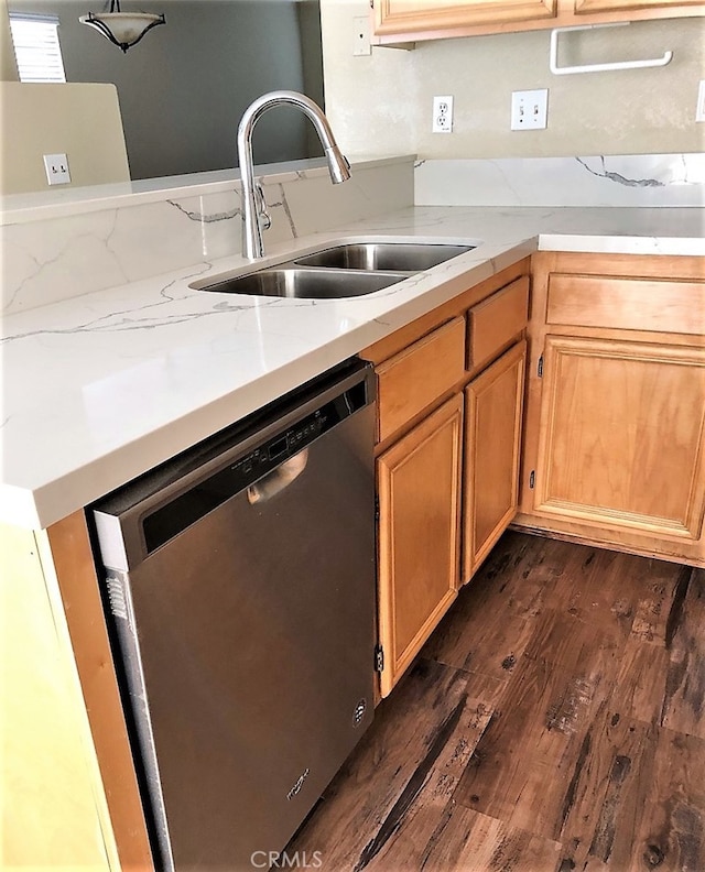 kitchen with dark hardwood / wood-style floors, dishwasher, and sink