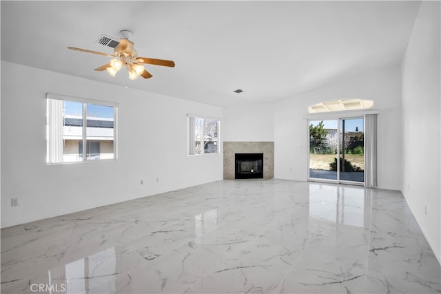 unfurnished living room with ceiling fan