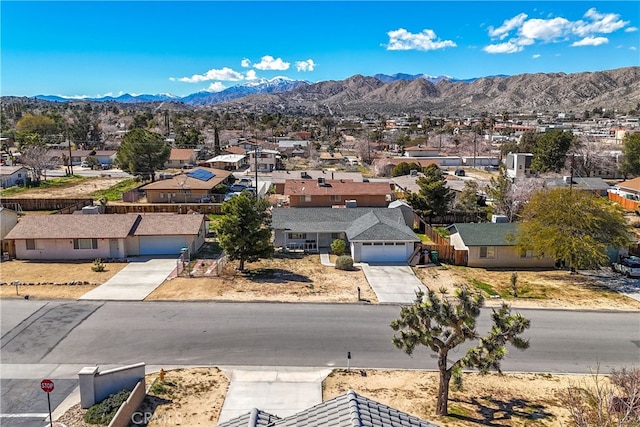 birds eye view of property featuring a mountain view