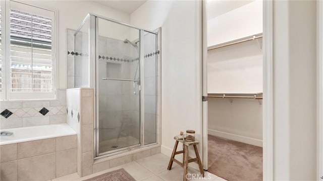 bathroom featuring tile patterned flooring and independent shower and bath