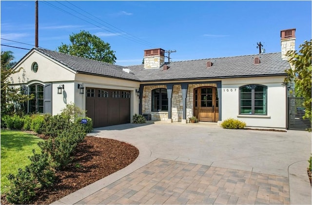 ranch-style house featuring a garage