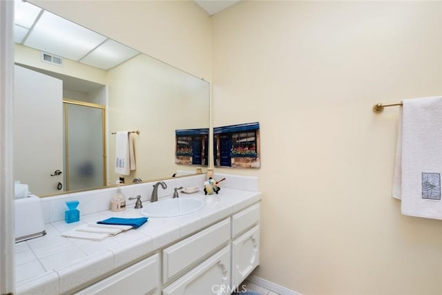 bathroom featuring vanity and walk in shower