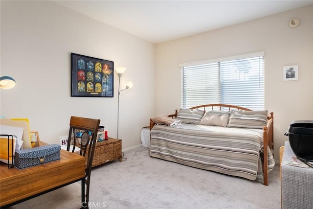 bedroom featuring light colored carpet