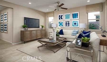 living room featuring ceiling fan and light wood-type flooring