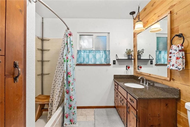 full bathroom featuring shower / bathtub combination with curtain, vanity, and baseboards