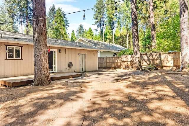 rear view of house with fence