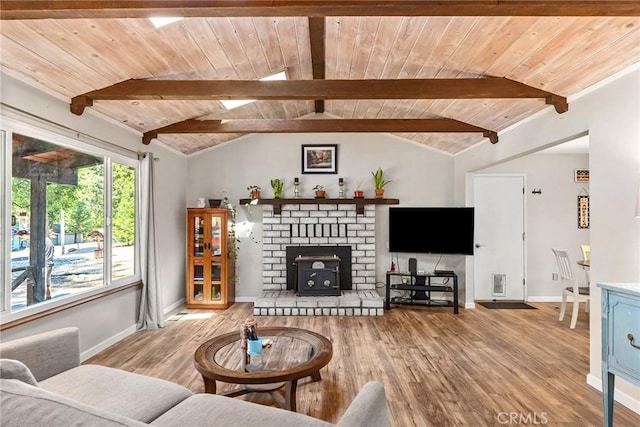 living room featuring wooden ceiling, wood finished floors, and vaulted ceiling with beams
