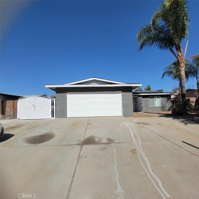 ranch-style house featuring a garage