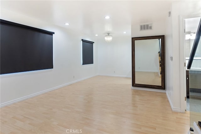 unfurnished room with light hardwood / wood-style floors