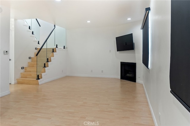 unfurnished living room with light hardwood / wood-style floors