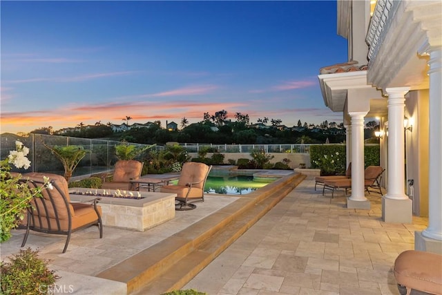 patio terrace at dusk with an outdoor fire pit