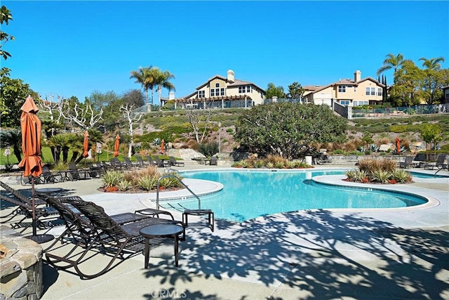 view of swimming pool with a patio