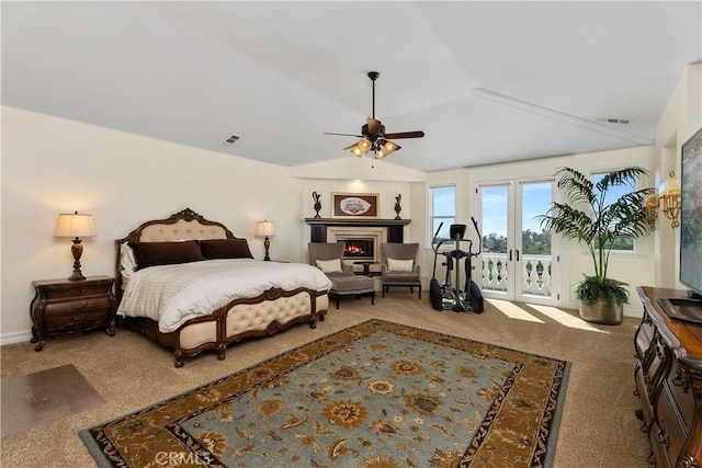 bedroom with ceiling fan, carpet, access to exterior, lofted ceiling, and french doors