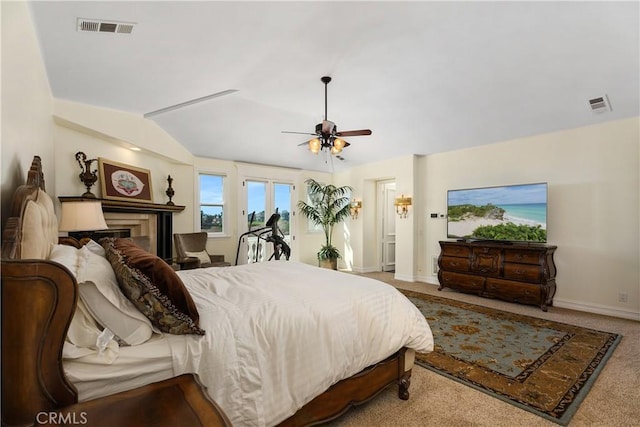 bedroom featuring ceiling fan, carpet floors, and lofted ceiling