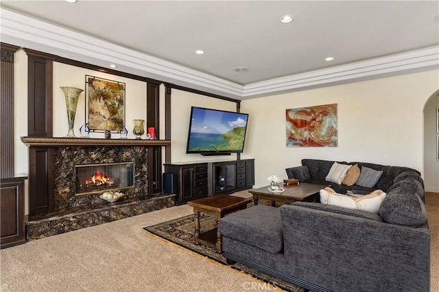 living room with carpet and a fireplace