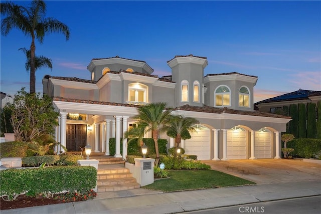 mediterranean / spanish-style home featuring a garage