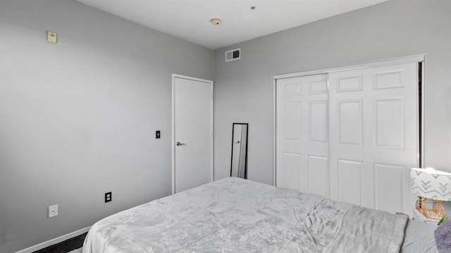 carpeted bedroom with a closet