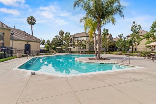 view of swimming pool featuring a patio