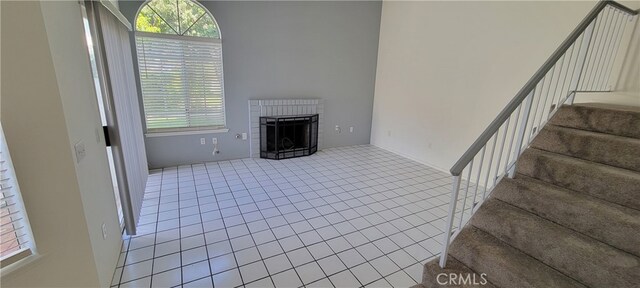 living room featuring a fireplace and tile patterned flooring