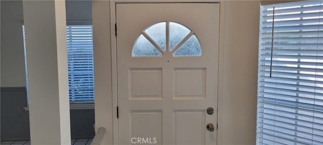 foyer entrance featuring tile patterned floors