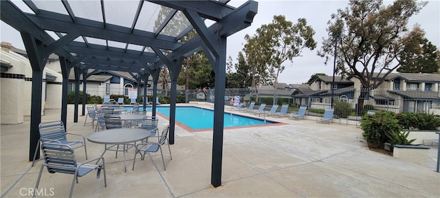 view of pool with a pergola and a patio