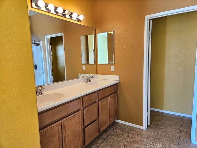 bathroom with vanity and tile patterned flooring