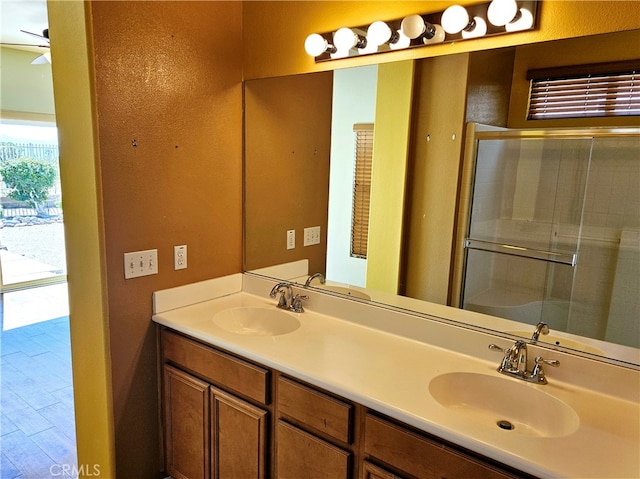 bathroom featuring vanity and an enclosed shower