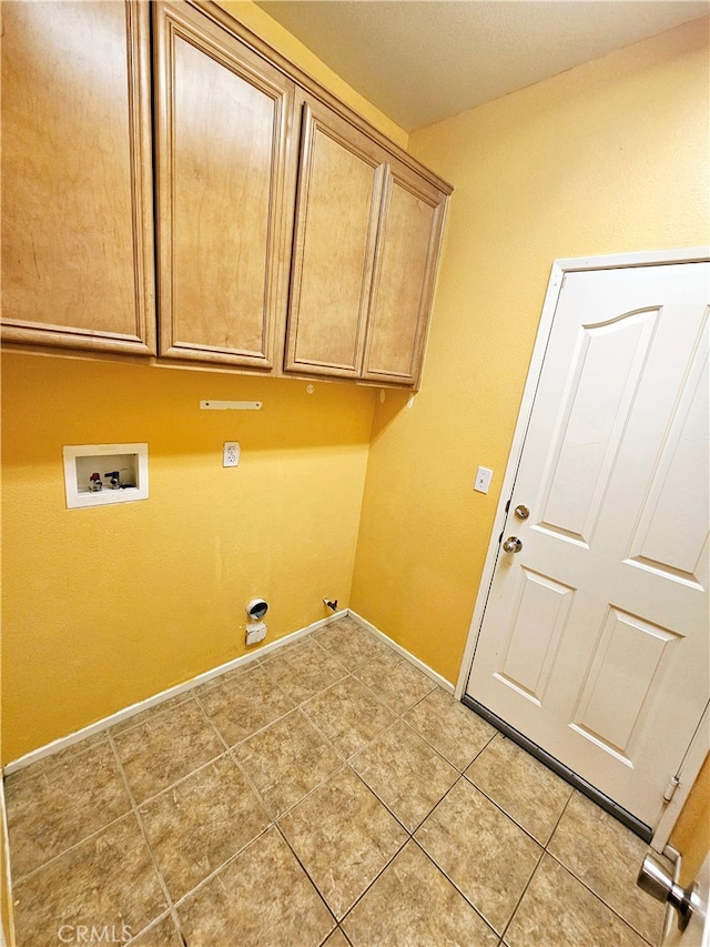 washroom with light tile patterned flooring, gas dryer hookup, washer hookup, and cabinets