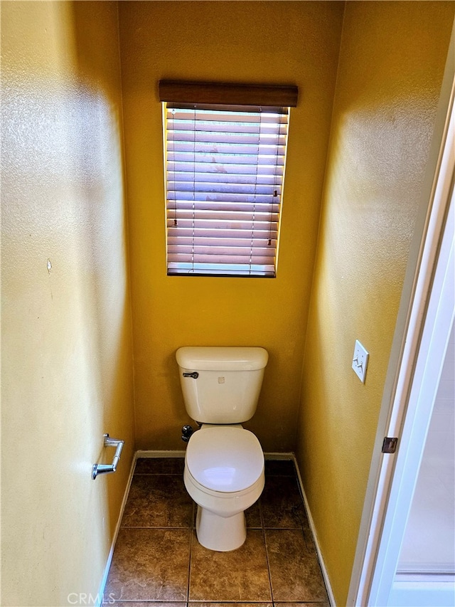 bathroom featuring tile patterned floors and toilet