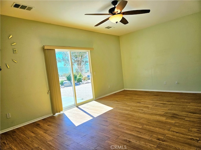 unfurnished room with hardwood / wood-style floors and ceiling fan