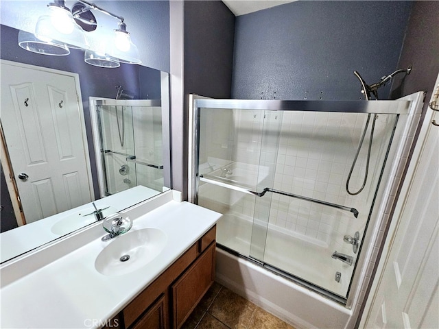 bathroom featuring vanity, tile patterned floors, and shower / bath combination with glass door