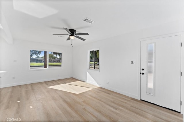 interior space with ceiling fan, plenty of natural light, and light hardwood / wood-style flooring