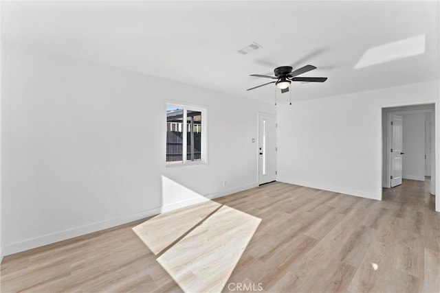 spare room featuring ceiling fan and light hardwood / wood-style flooring