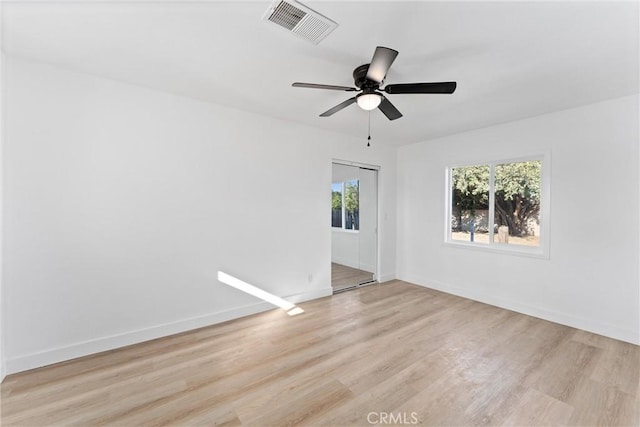 unfurnished room with light hardwood / wood-style floors and ceiling fan