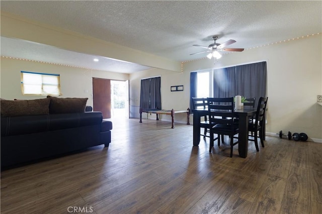 3604 Campbell St, Jurupa Valley, CA 92509 - dining room featuring dark wood-style floors, plenty of natural light, a textured ceiling, ceiling fan, and baseboards
